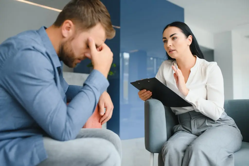 Counselor talking with a client during anger management therapy in Centre County, PA